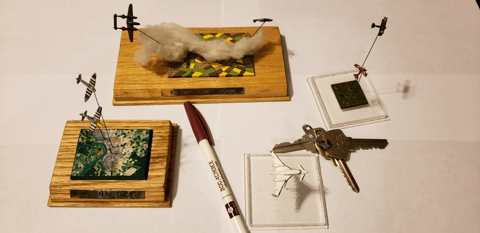 A few of Rumminger’s 1/525th scale models, with pen and keys shown for scale.